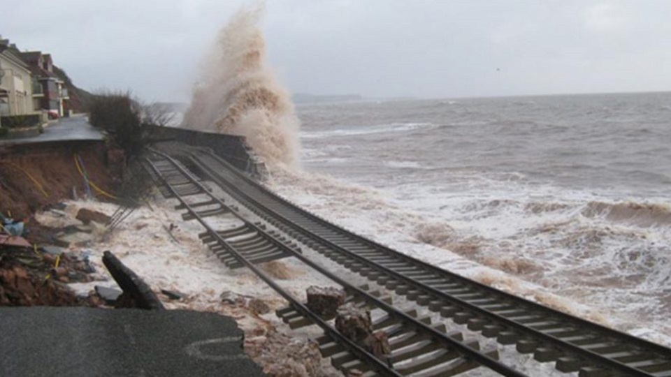 Huge wave breaks over the damaged tracks at Dawlish on the Devon seafront