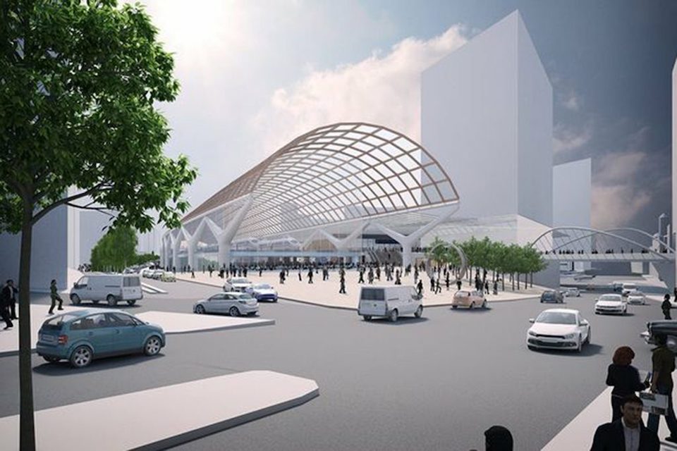 A computer generated image of the HS2 station at Piccadilly in Manchester showing the large plaza and the barrel roof design