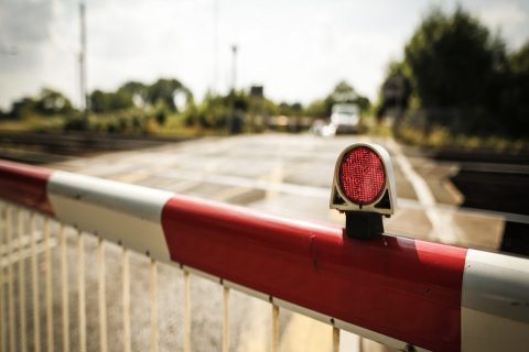 Level crossing barrier with red light