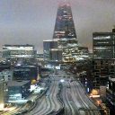 Nighttime shot of snowy London skyline showing railway tracks approaching London Bridge with The Shard on the skyline