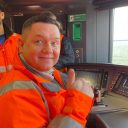 Portrait of Craig Pearson at the controls of a new Metro train in Brno
