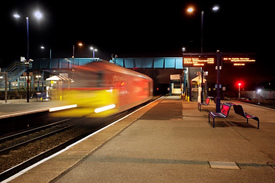 Locomotive at speed through Barnetby station in the UK