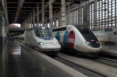 Renfe AVE and Ouigo train in Madrid station Puerta de Atocha