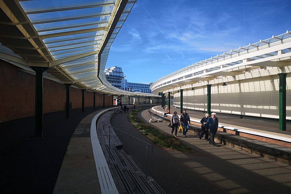 Some visitors examine the curved platforms of Folkestone Harbour