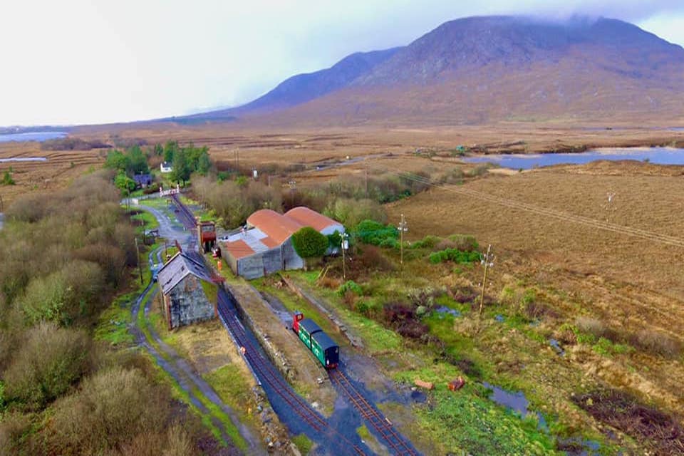 A distant sky view of the station at Maam Cross in the mountainous countryside of Galway in Ireland