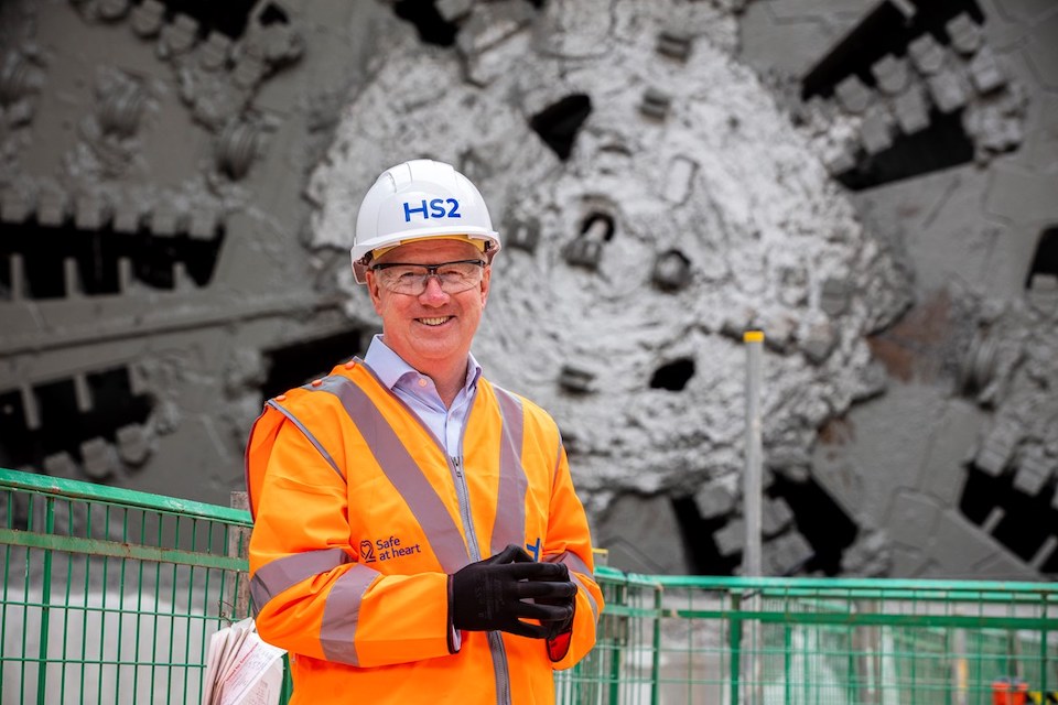 Image of Mark Thurston, the CEO of HS2 Limited, in front of a tunnel boring machine head
