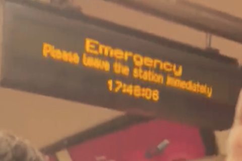 Station indicator board displaying emergency message