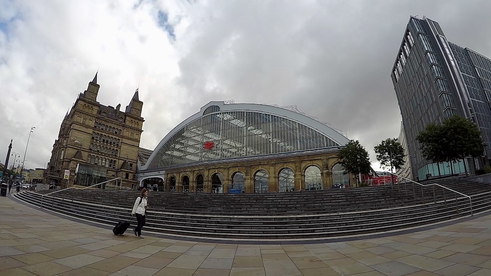 Exterior of Liverpool Lime Street station showing the barrel roof and steps