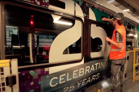 25 Years anniversary vinyls being applied int eh workshop to a Heathrow Express train