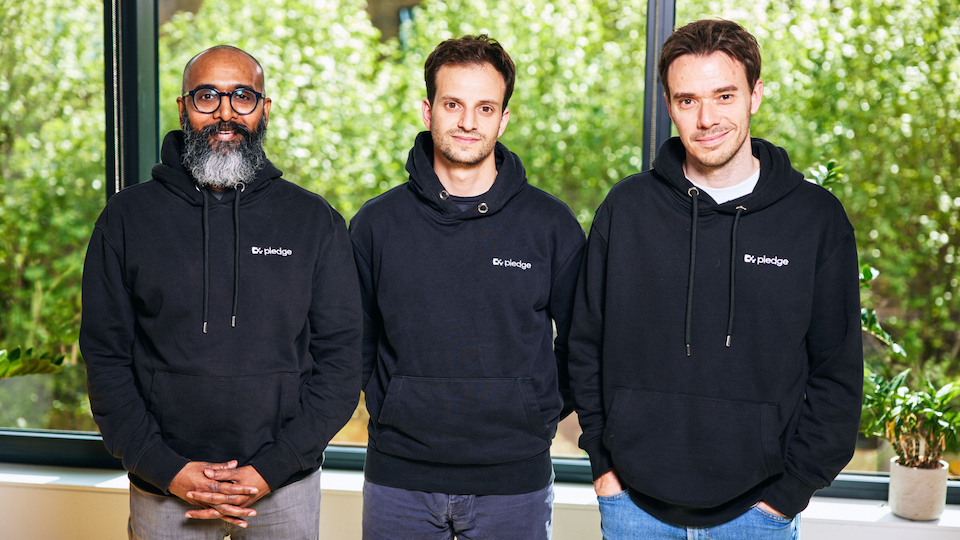 The three founders of Pledge pose for a group shot in their corporate hoodies