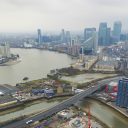 Aerial shot of the East End of London Docklands redevelopment project with the Thames and O2 arena