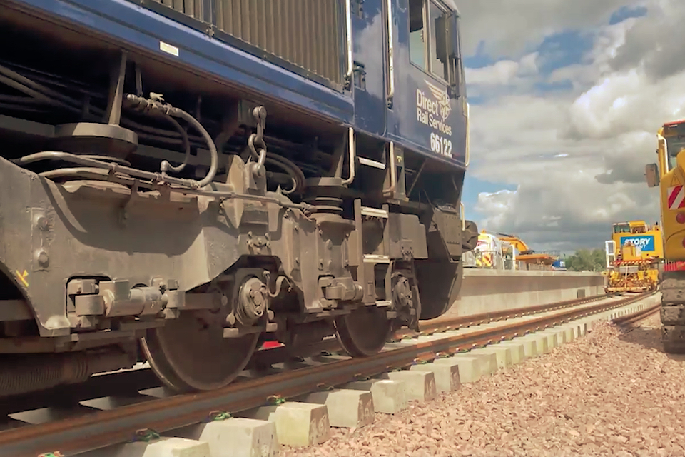 Ground level view of DRS class 66 on engineering train at Cameron Bridge on Levenmouth Railway Project in Scotland