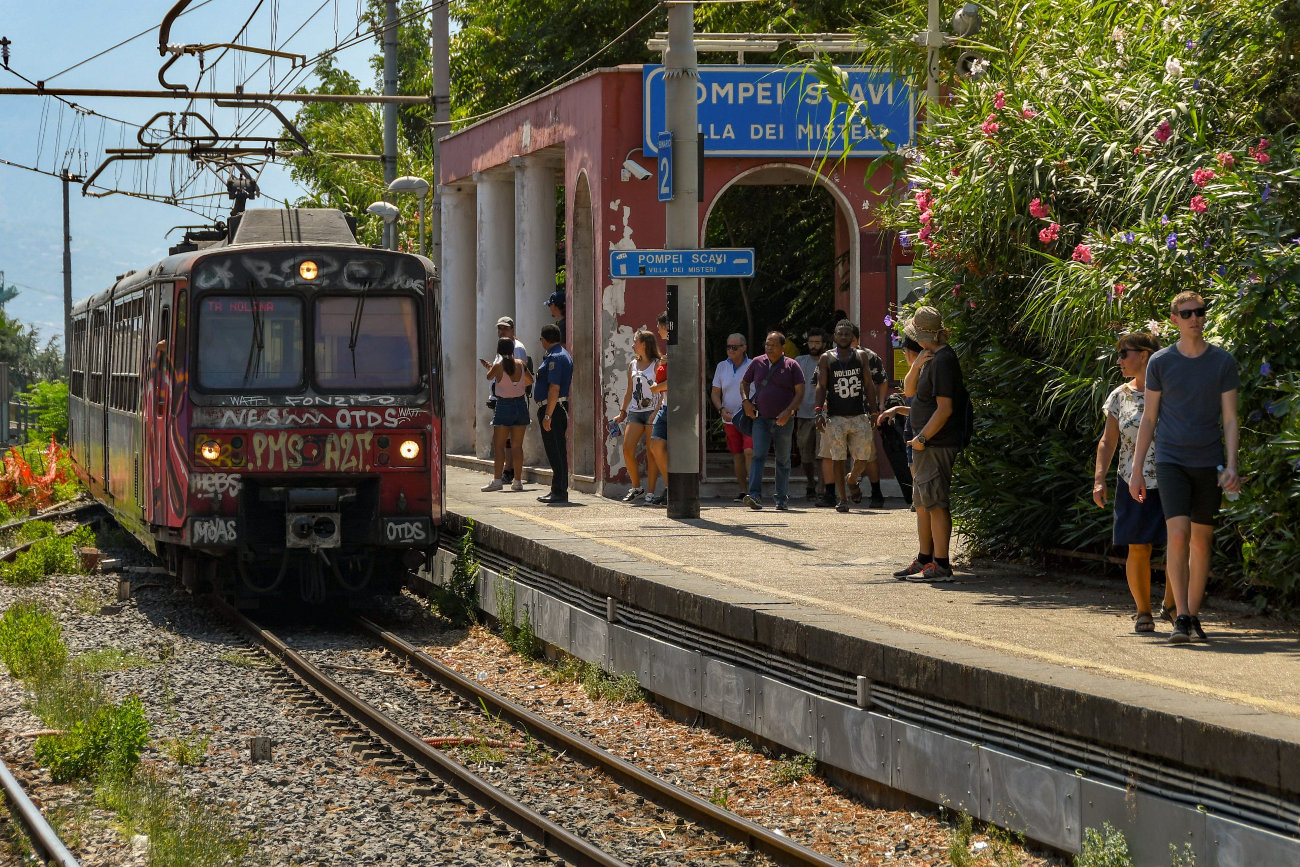 Electric train approaching Platform 2 of Pompeii Scavi station on its way to Naples in 2019. (Shutterstock)