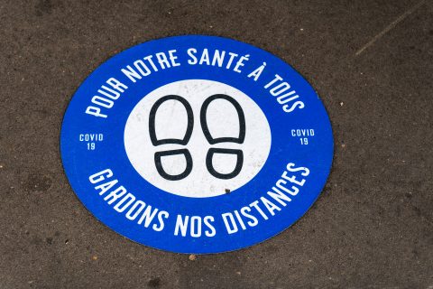 Close up view of a Social distance sticker in Paris during Covid-19 pandemic in France (Shutterstock)