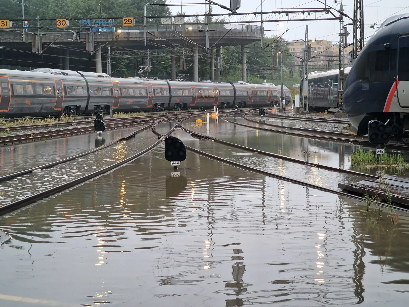 Flooded parking facility for trains in Norway after heavy rain in the night of August 27