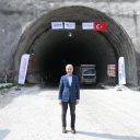 Turkish transport minister posing at a tunnel for the high-speed railway line
