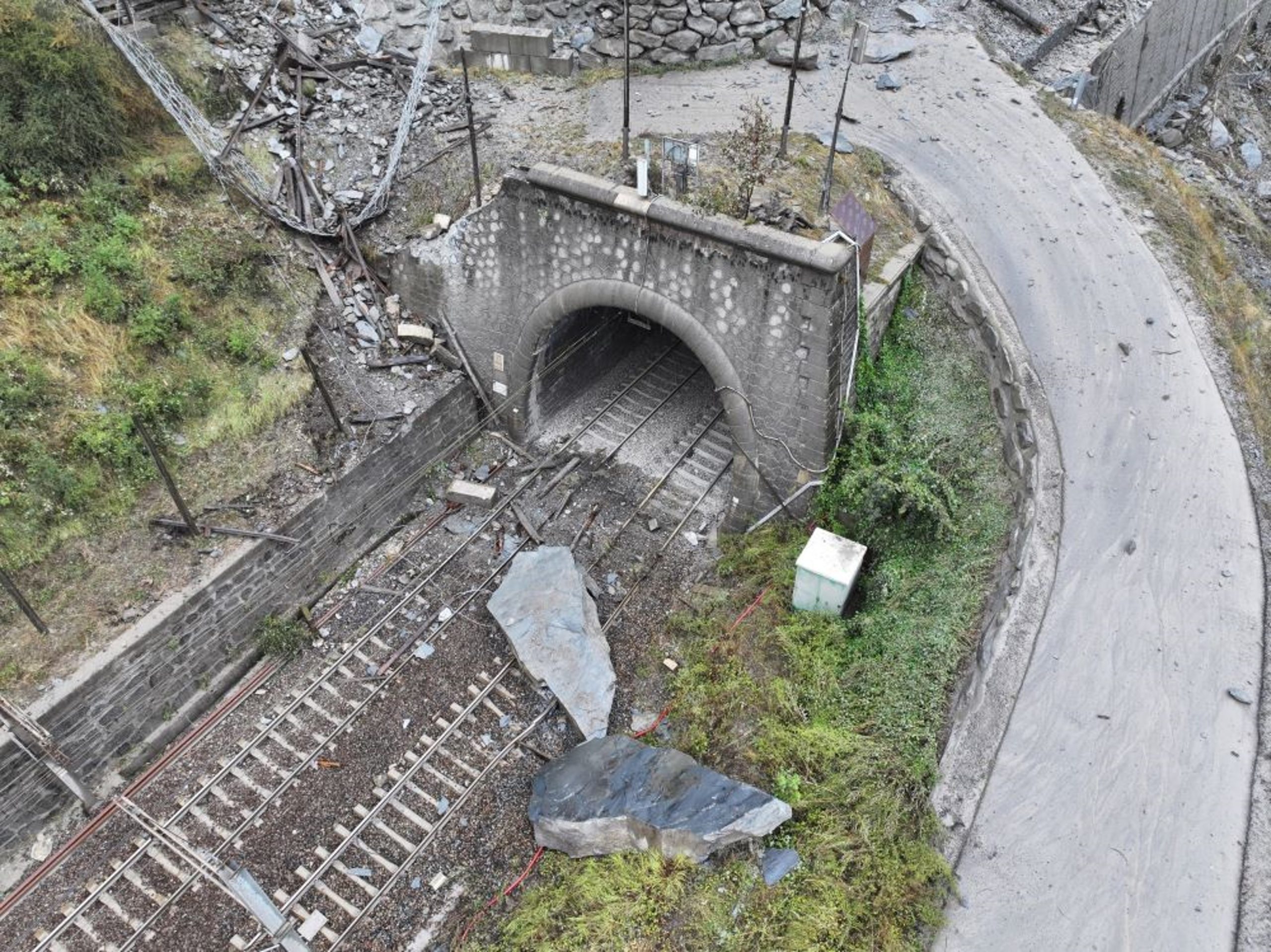 Drone shot showing debris still blocking the Fréjus railway tunnel