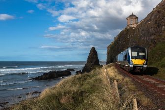 Castlerock,Northern Ireland. June 3rd 2016. Translink, Northern Ireland railway service emerging from the tunnel at Downhill