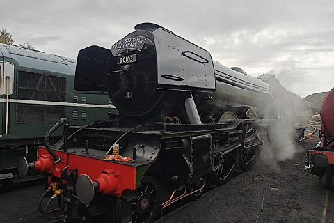 Three quarter view of Flying Scotsman steam locomotive in siding at Aviemore in Scotland