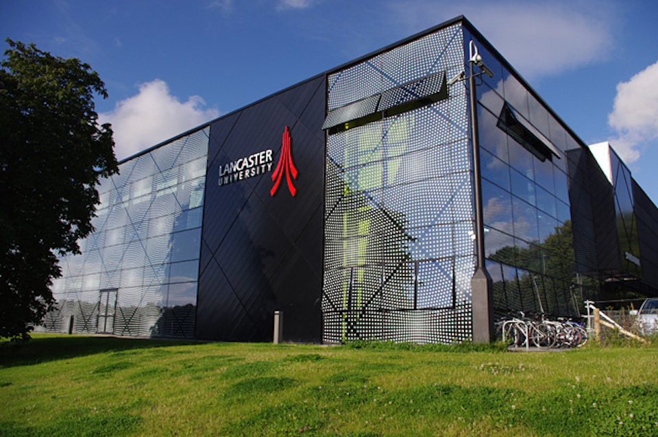 Lancaster University building in steel and glass with red logo