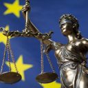 Lady Justice in front of an EU flag