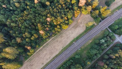 Aerial view of train tracks through a German forest near Munich