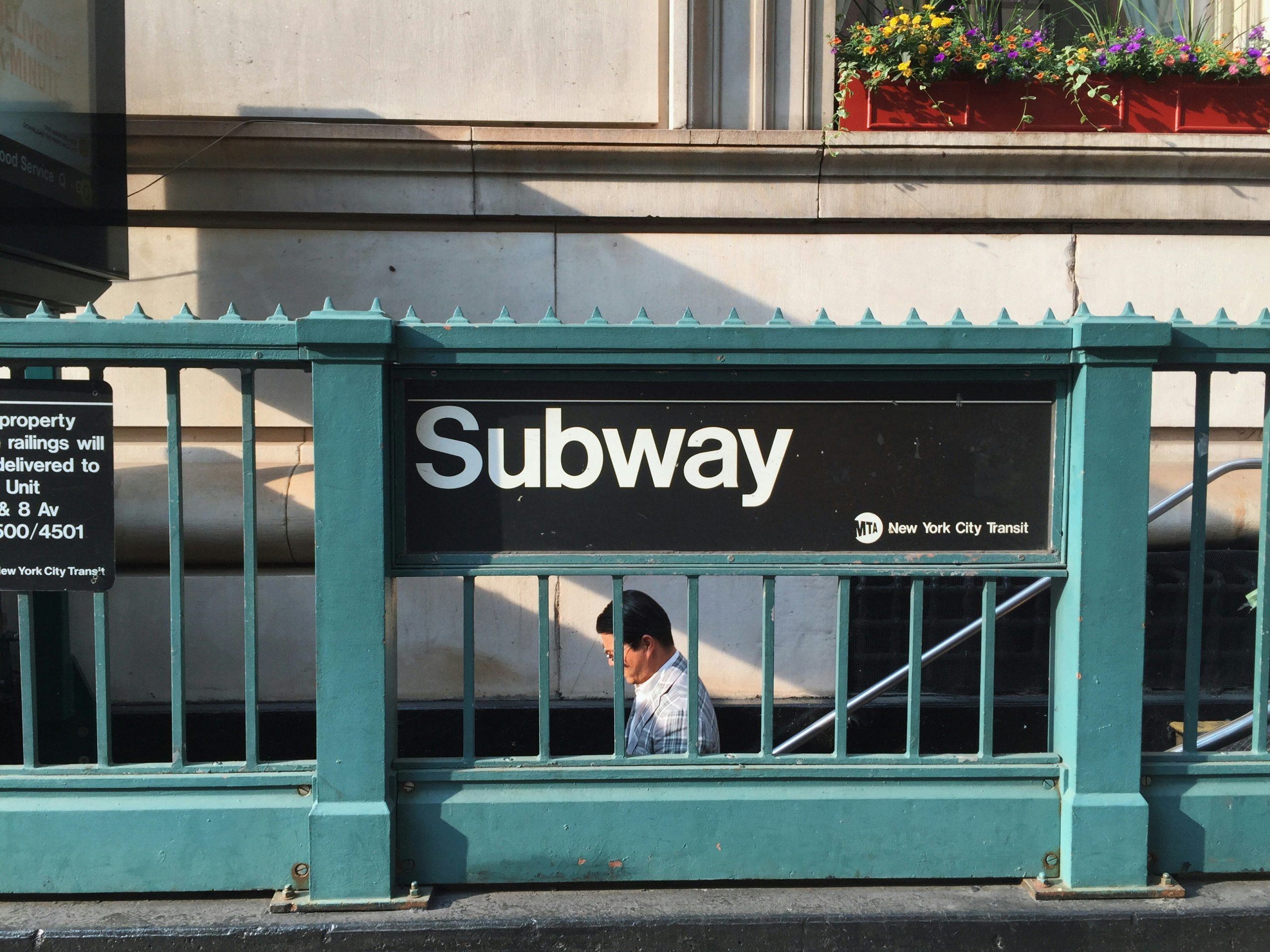 NYC Subway sign (Wells Baum on Unsplash)
